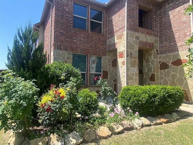 8740 Running River Ln, Fort Worth, TX 76131 - property entrance with stone siding and brick siding