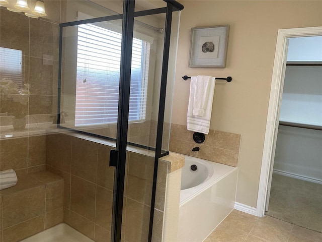 8740 Running River Ln, Fort Worth, TX 76131 - full bath with a shower stall, a bath, tile patterned floors, and a walk in closet
