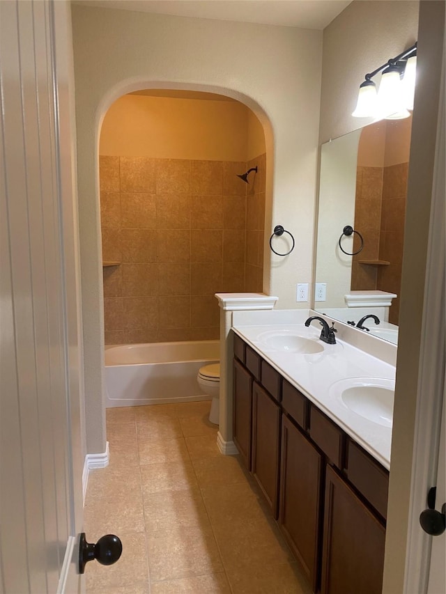 8740 Running River Ln, Fort Worth, TX 76131 - full bathroom featuring toilet, tile patterned floors, double vanity, and washtub / shower combination