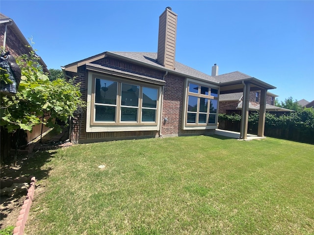 8740 Running River Ln, Fort Worth, TX 76131 - back of house with a chimney, brick siding, and a shingled roof