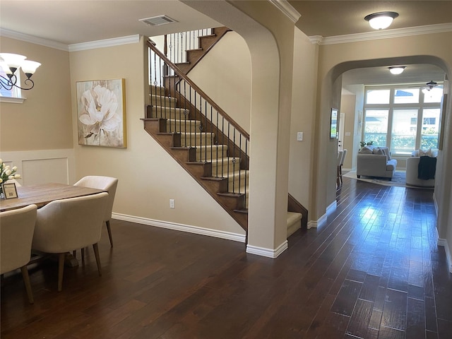 8740 Running River Ln, Fort Worth, TX 76131 - entrance foyer with arched walkways, crown molding, stairs, wood-type flooring, and a chandelier