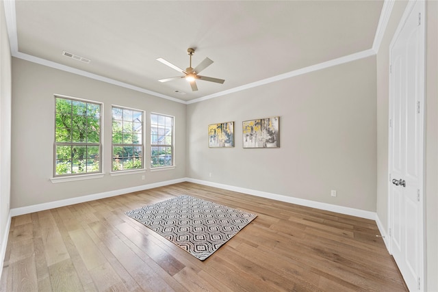 1608 Coventry Ct, Farmers Branch, TX 75234 - spare room featuring a ceiling fan, baseboards, wood finished floors, and ornamental molding