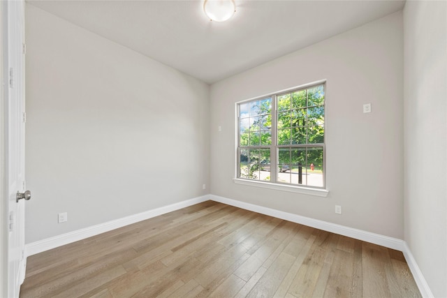 1608 Coventry Ct, Farmers Branch, TX 75234 - spare room featuring wood finished floors and baseboards