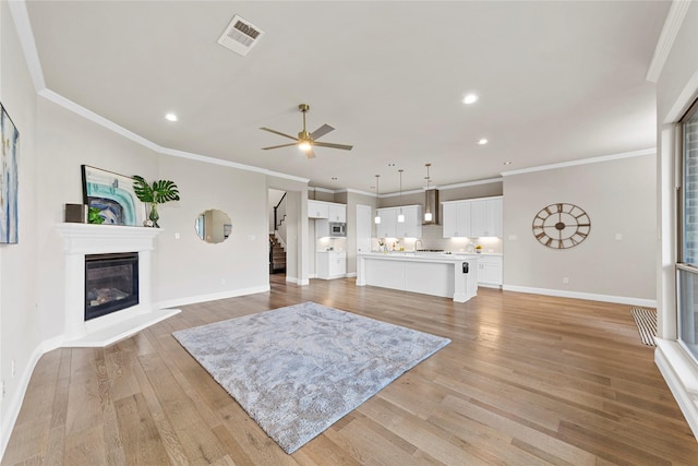 1608 Coventry Ct, Farmers Branch, TX 75234 - living area featuring light wood finished floors, recessed lighting, stairs, baseboards, and ceiling fan