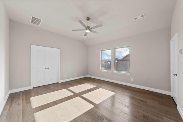1608 Coventry Ct, Farmers Branch, TX 75234 - unfurnished bedroom with wood-type flooring, baseboards, a closet, ceiling fan, and lofted ceiling