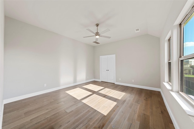 1608 Coventry Ct, Farmers Branch, TX 75234 - unfurnished room with plenty of natural light, wood finished floors, ceiling fan, baseboards, and lofted ceiling