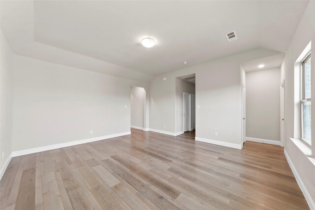 1608 Coventry Ct, Farmers Branch, TX 75234 - unfurnished room with light wood finished floors, healthy amount of natural light, lofted ceiling, and baseboards