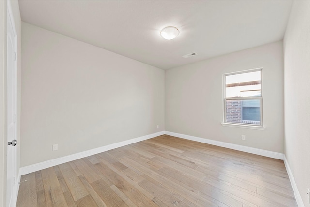 1608 Coventry Ct, Farmers Branch, TX 75234 - empty room with light wood-style flooring and baseboards