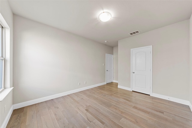 1608 Coventry Ct, Farmers Branch, TX 75234 - unfurnished room with light wood-type flooring and baseboards