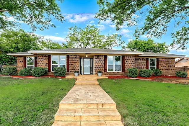 1305 Willow Way, Garland, TX 75043 - single story home featuring brick siding and a front yard