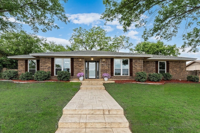 1305 Willow Way, Garland, TX 75043 - ranch-style house featuring brick siding and a front yard