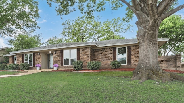 1305 Willow Way, Garland, TX 75043 - single story home featuring brick siding and a front yard