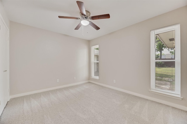 1305 Willow Way, Garland, TX 75043 - unfurnished room with light carpet, baseboards, and ceiling fan