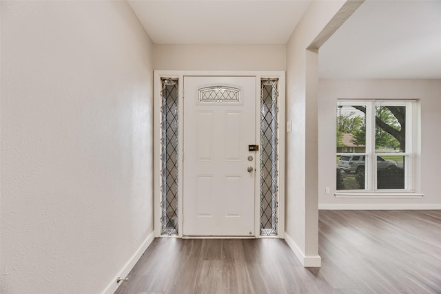 1305 Willow Way, Garland, TX 75043 - foyer entrance featuring wood finished floors and baseboards