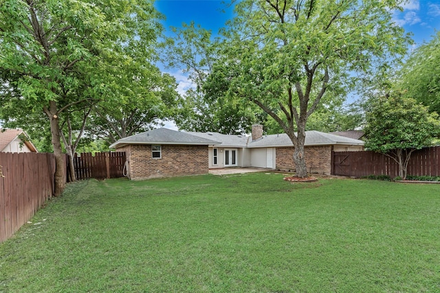 1305 Willow Way, Garland, TX 75043 - view of yard with french doors, an attached garage, and a patio
