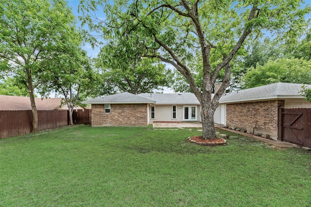 1305 Willow Way, Garland, TX 75043 - rear view of house featuring brick siding and a patio
