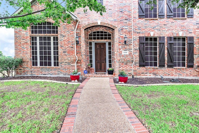 11086 Tenison Ln, Frisco, TX 75033 - property entrance with brick siding and a lawn