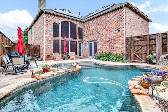 11086 Tenison Ln, Frisco, TX 75033 - view of swimming pool featuring a fenced backyard, a patio area, a gate, and a pool with connected hot tub