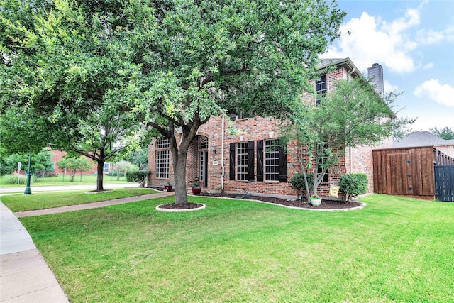 11086 Tenison Ln, Frisco, TX 75033 - view of front of property with brick siding, a chimney, and a gate