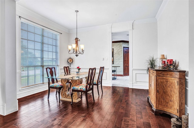11086 Tenison Ln, Frisco, TX 75033 - dining space featuring a chandelier, dark wood-style floors, ornamental molding, and a wainscoted wall