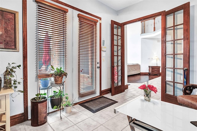 11086 Tenison Ln, Frisco, TX 75033 - doorway featuring french doors, baseboards, and tile patterned floors