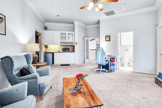 11086 Tenison Ln, Frisco, TX 75033 - carpeted living area featuring a ceiling fan, crown molding, a dry bar, and baseboards