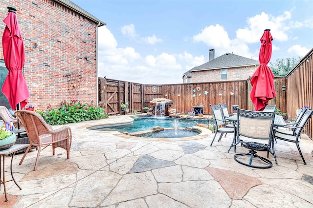 11086 Tenison Ln, Frisco, TX 75033 - view of pool featuring a patio area, a fenced backyard, and a pool with connected hot tub