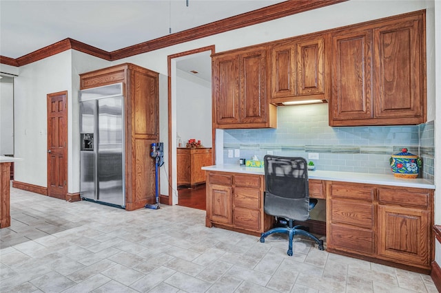 11086 Tenison Ln, Frisco, TX 75033 - home office featuring built in study area, crown molding, and baseboards