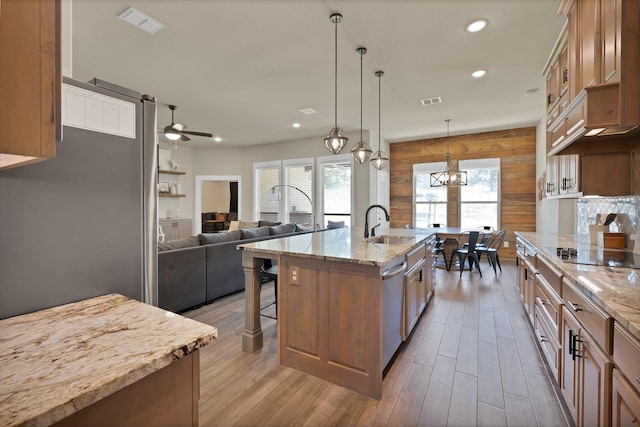 149 Deats Farm Ct, Azle, TX 76020 - kitchen with black electric cooktop, a kitchen bar, ceiling fan, wood finished floors, and recessed lighting