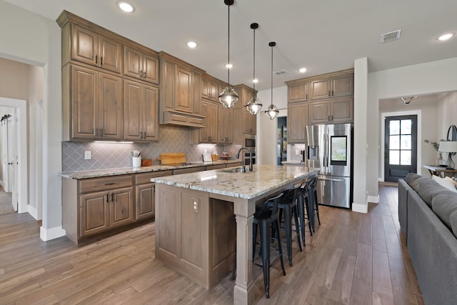 149 Deats Farm Ct, Azle, TX 76020 - kitchen featuring stainless steel fridge with ice dispenser, baseboards, a sink, tasteful backsplash, and recessed lighting