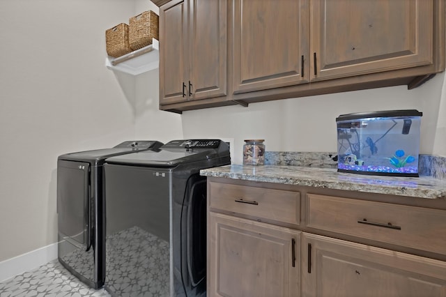 149 Deats Farm Ct, Azle, TX 76020 - washroom featuring washing machine and dryer, cabinet space, baseboards, and light floors