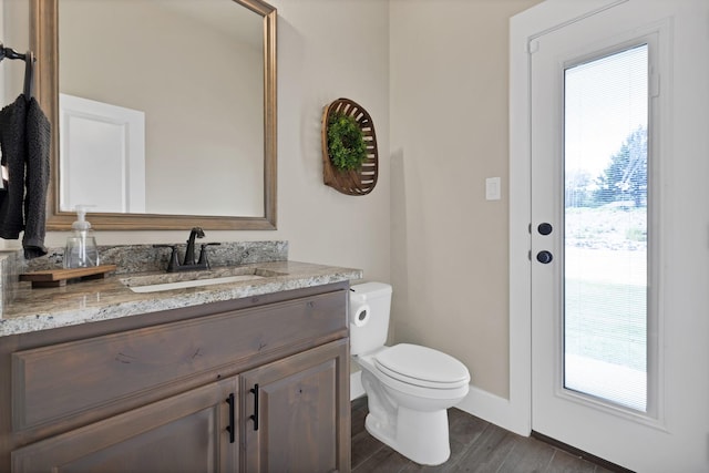 149 Deats Farm Ct, Azle, TX 76020 - bathroom with plenty of natural light, vanity, toilet, and wood finished floors