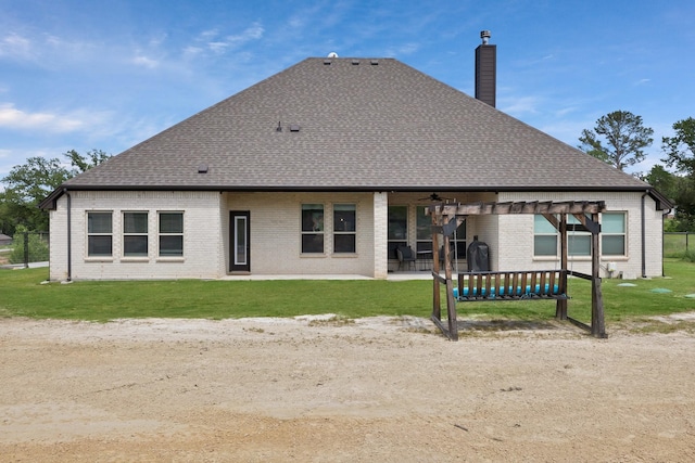 149 Deats Farm Ct, Azle, TX 76020 - rear view of house featuring a chimney, a ceiling fan, brick siding, and a yard