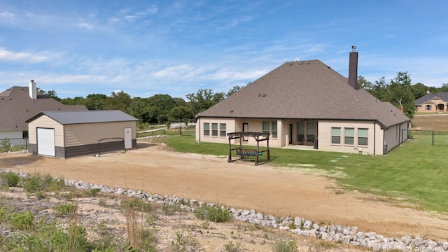 149 Deats Farm Ct, Azle, TX 76020 - back of house with a chimney, an outbuilding, a shingled roof, and a detached garage