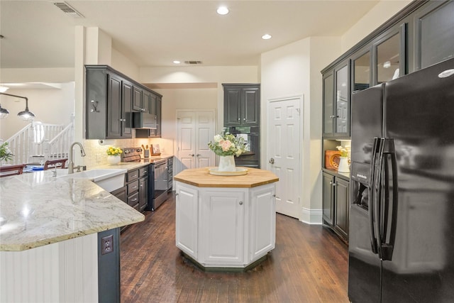 561 Farms Rd, New Hope, TX 75071 - kitchen with black appliances, a sink, dark wood finished floors, a center island, and glass insert cabinets