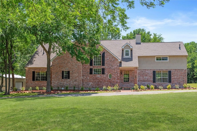 561 Farms Rd, New Hope, TX 75071 - view of front of home with a front yard, a chimney, and brick siding