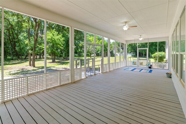561 Farms Rd, New Hope, TX 75071 - unfurnished sunroom featuring ceiling fan, view of scattered trees, and healthy amount of natural light