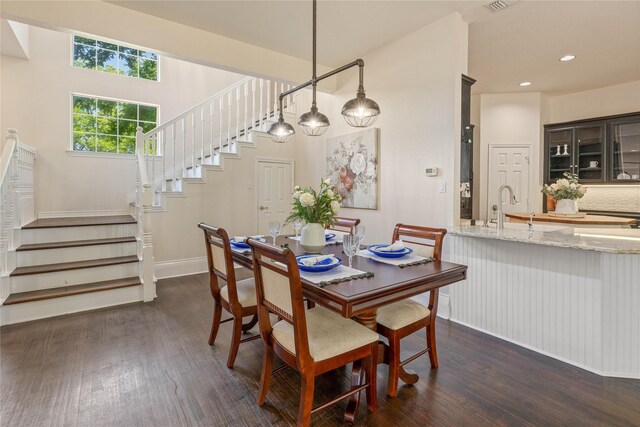 561 Farms Rd, New Hope, TX 75071 - dining area with dark wood-type flooring, stairs, baseboards, and recessed lighting
