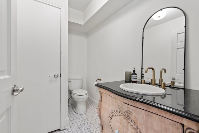 201 Forest Trce, Rockwall, TX 75087 - bathroom featuring toilet, vanity, and baseboards