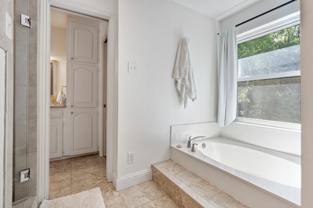 201 Forest Trce, Rockwall, TX 75087 - full bathroom featuring a garden tub, baseboards, vanity, and a shower stall