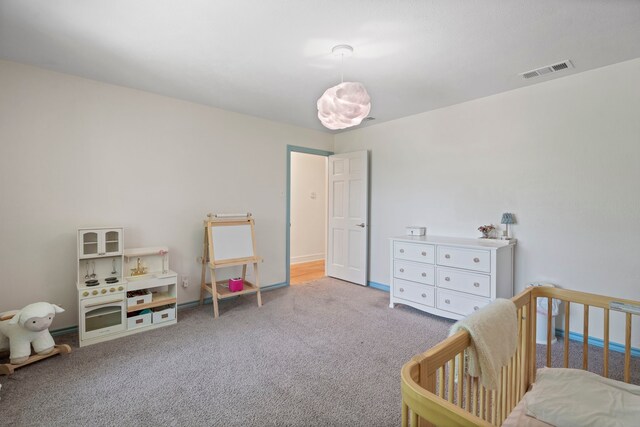 201 Forest Trce, Rockwall, TX 75087 - carpeted bedroom featuring a crib