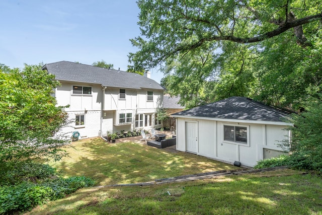 201 Forest Trce, Rockwall, TX 75087 - back of house featuring a yard, an outdoor structure, a chimney, and a shingled roof