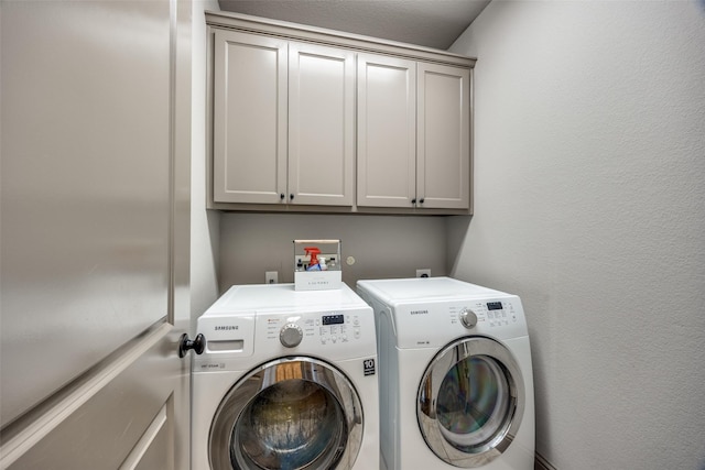 4944 Sage Hill Dr, Carrollton, TX 75010 - laundry room featuring cabinet space and washing machine and dryer