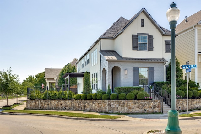 4944 Sage Hill Dr, Carrollton, TX 75010 - view of front of house featuring brick siding, a standing seam roof, and metal roof