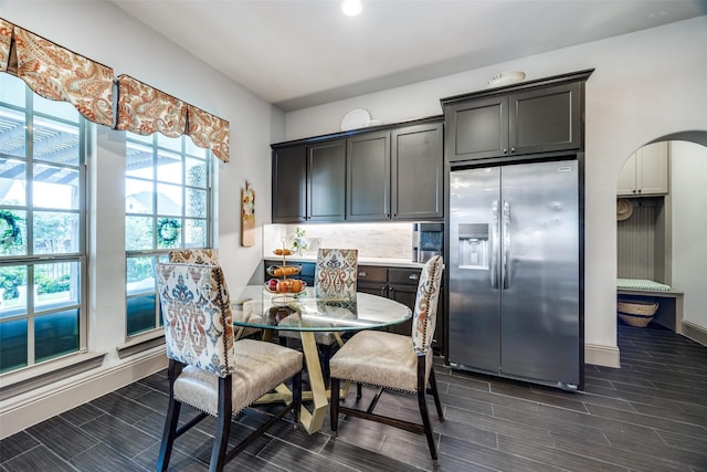 4944 Sage Hill Dr, Carrollton, TX 75010 - dining area featuring wood tiled floors and baseboards