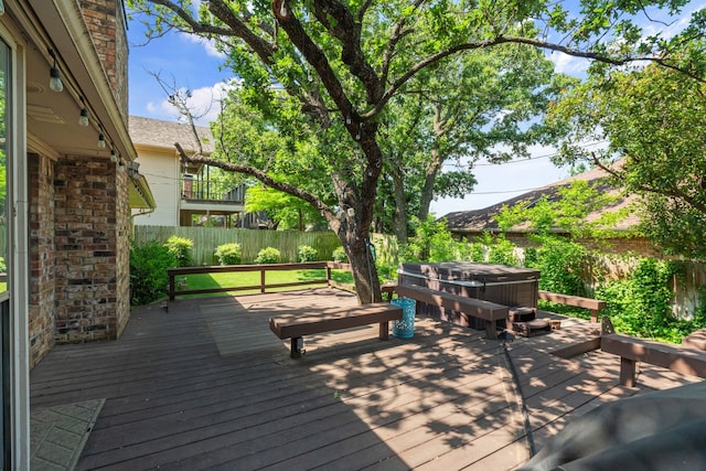 1009 Windmill Ln, Irving, TX 75061 - wooden terrace featuring a hot tub and a fenced backyard