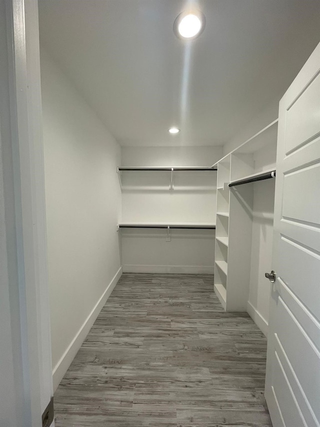 1315 W Gandy St, Denison, TX 75020 - walk in closet featuring wood finished floors