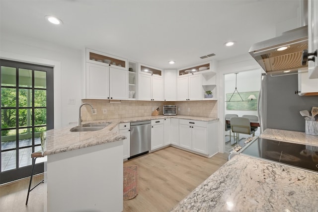 2006 Country Oaks Dr, Garland, TX 75040 - kitchen featuring a sink, open shelves, stainless steel dishwasher, a peninsula, and light wood-style flooring