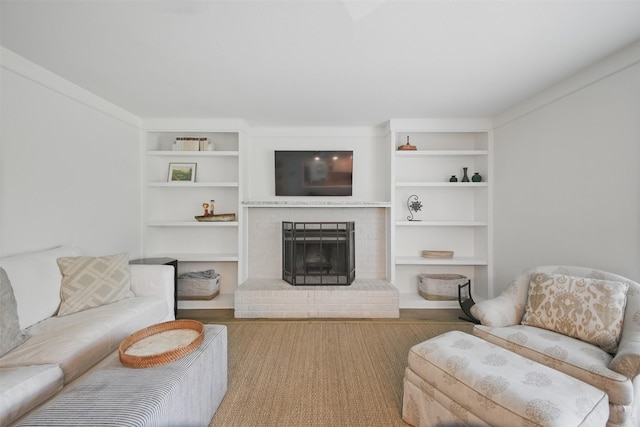2006 Country Oaks Dr, Garland, TX 75040 - living room featuring built in shelves and a brick fireplace