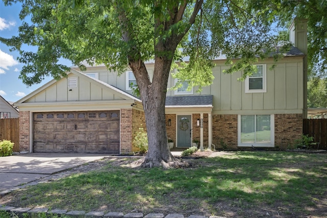 2006 Country Oaks Dr, Garland, TX 75040 - view of front of house featuring brick siding, concrete driveway, an attached garage, and a chimney